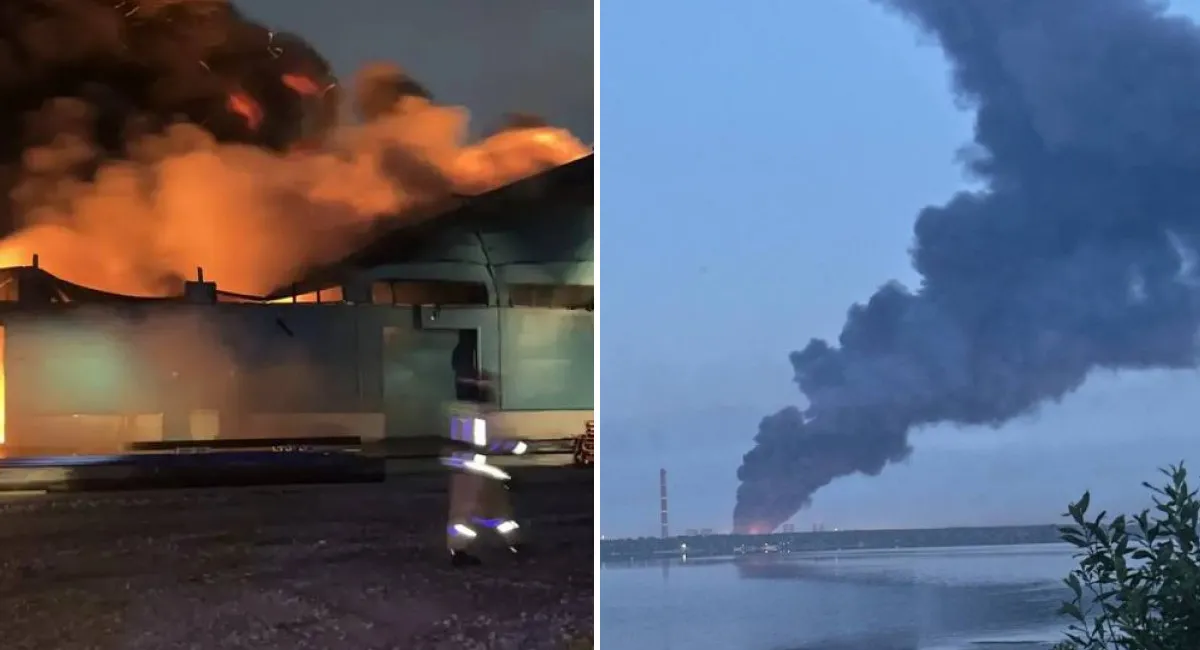 Ночной пожар на складе и большой столб чёрного дыма над водой